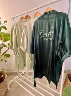 💖Hello!! Pretty Lady..💖 WithLovePjs is delighted to offer you these magnificent & most comfortable Silky Satin Bridal Robes for brides & bridesmaids. These Sage green & Forest green robes with HTV print are a perfect combination for you & your bridesmaids to get ready in them. These Silk Kimono Robes are beautifully designed with lots of love and hard work for you to look very stylish in your wedding parties, as they are made of soft & silky Satin fabric, you could also use them as a lounge we Green Satin Set For Summer, Green Satin Sets For Summer, Green Satin Summer Set, Green Long Sleeve Wedding Robe, Sage Green Forest, Bride Robes, Personalized Robes, Robes Silk, Satin Bridal Robe