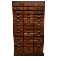 an old wooden cabinet with many drawers