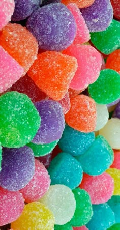 many different colored candies are stacked on top of each other in the shape of hearts