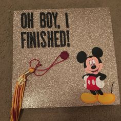 a mickey mouse graduation cap that says, oh boy i finished