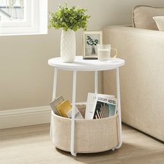 a small white table with magazines in it