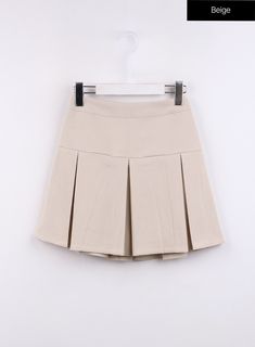 solid-pleated-mini-skirt-cj425 / Beige Pleated Tennis Skirt For School Uniform In Fall, Lined Skirt Skort For School, Pleated Tennis Skirt For School Uniform, Fall Style, Pleated School Uniform Tennis Skirt For Fall, Lined Skort For School, Casual Skirted Skort With Accordion Pleats, Casual Accordion Pleated Skort, School Mini Skirt Solid Color With Lined Skirt, School Uniform Style Pleated Mini Skirt