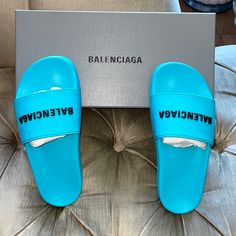 New Balenciaga Poolside Slides, Color Turquoise/Black, Brand Signature Logo, Across The Foot Arch, In Contrasting Black Color, 100% Rubber & Water Repellent, Molded Comfort Footbed, Balanciaga Logo Under The Sole, Fit’s European Size 38, Fits Us Size 8, Made In Italy, Including Box & Dust Bags Designer Blue Slides For Summer, Balenciaga Blue, Balenciaga Shoes, Color Turquoise, Signature Logo, Repellent, Water Repellent, Black Blue, Balenciaga