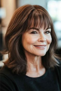 Medium Layers with Soft Bangs Hairstyle on a smiling woman with brown hair. Medium Layers, Shoulder Length Waves, Straight Lobs, Framing Bangs, Gentle Movement, Red Balayage, Face Framing Bangs, Soft Face, Natural Wavy Hair