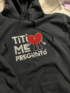 Bad Bunny Titi Me Pregunto embroidered hoodie. Long sleeve, black cotton hoodie. Made to order Size S-2X Bad Bunny Heart Sweater, Bad Bunny Sweater Cricut, Bad Bunny Hoodie Ideas, Bad Bunny Embroidery Sweater, Bad Bunny Promposal, Bad Bunny Merch, Hoodie Design Ideas, Bunny Hoodie, Things I Need To Buy