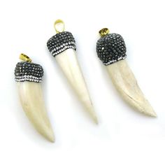 Pave Pendant , Imitation Bone Incisor Pendant, Zircon Pave Long Bone Pendant Stone: Imitation ox bone Pave: Top paved Type: Pendant Bail: Gold plated brass  Pendant Material: Imitation Ox bone * Note: Bone is slightly sharp, not a dulled bone Shape: Elephant tusk, husk, long bone Measurement: 50-60mm long by 11-15mm in thickness Weight: 9-14 grams per piece. SKU#: 292022 Quantity: 1 pendant The last picture shows a small selection of our variety of chains showcasing the pendants. For our en Elephant Tusk, Tusk Pendant, Tusk Necklace, Bone Pendant, Body Adornment, Pendant Bails, Pave Pendant, Jewelry Making Charms, Brass Pendant