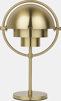 a gold table lamp on a white background