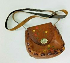 Women's Mexican Tooled Leather Crossbody Bag Size : Approx. 7" H x 7" W x 2.5" D Drop : 48" Pre-owned in excellent condition Painted Handbag, Hippie Purse, Boho Purse, Into The West, Tooled Leather Bag, Tooled Leather Purse, Floral Purse, Cognac Color, Braided Strap