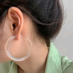 - Acrylic - Color: Clear - Circle Shape - Height: 2.1" - Weight: 2.1" - Plastic Trendy White Round Hoop Earrings, Casual Hoop Earrings For Gift, Casual Everyday Hoop Jewelry, Modern Small Hoop Earrings In Plastic, Modern Plastic Hoop Earrings, Modern Plastic Hoop Jewelry, Trendy Plastic Hoop Earrings, Trendy Clear Hoop Earrings, Trendy Clear Hoop Jewelry