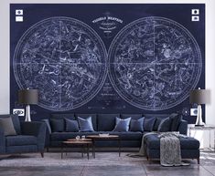 a living room filled with furniture and a giant map on the wall