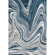 a blue and white rug with wavy lines