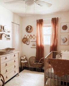 a baby's room with a crib and dresser