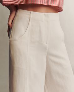 Signature high-rise floor length pant crafted in polished, and sheen coated viscose linen. This paneled pant is fitted at the hip and flares into a dramatic wide leg. Complete with a zip-fly, hook and eye fastening and deep side pockets. 76% VISCOSE, 24% LINEN Model is 5'10'' with 32.5'' bust / 34.5'' hips. Wearing size 4 Heel Accessories, Knit Sweatshirt, Pants Design, Denim Leggings, Denim Flares, Sweater Blouse, Denim Pant, Sweater Skirt, Blazer Coat