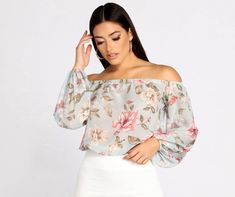 Get all those flowy floral feels in this lightweight chiffon crop top! A major spring time vibe for sure.Fit & Features
Elastic banded off the shoulder neckline
Long loose sleeves | Elastic banded cuffs
Cropped elastic banded hem
Sheer chiffon... Chiffon Styles, Chiffon Crop Top, Flowy Crop Top, Spring Wedding Guest Dress, Chiffon Floral