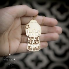 "This Japanese Kokeshi necklace featured a girl wearing kimono with a unique Japanese pattern. This design was inspired by the traditional Japanese style a girl decorated with the famous cherry blossom- sakura flower. This necklace will add chic to any outfit you choose. ★This is the gold item, for the silver item use this link: https://www.etsy.com/listing/693962323 ♥WANT TO MAKE IT PERSONAL? ♥ Add a charm letter to your necklace - Add this item: https://www.etsy.com/il-en/listing/687931684 ★ C Jewelry Japanese, Asian Necklaces Jewelry, Japanese Jewelry Modern, Traditional Japanese Jewelry, Japanese Necklace Traditional, Hamsa Earrings, Japanese Jewelry, Sakura Flower, Geek Gifts