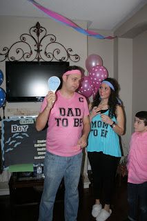 a man and woman standing in front of balloons