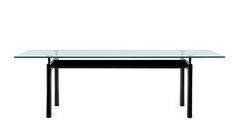 a glass table with black legs on a white background