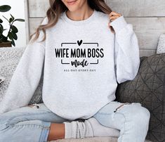 Stay in 'Wife Mom Boss' Mode with this Trendy, Comfy Sweatshirt - Perfect Gift for Busy Moms! Introducing our Wife Mom Boss Mode Sweatshirt, the perfect apparel for all the fierce women out there! This sweatshirt is not just a clothing item, but a declaration of your multitasking skills and incredible power. Made with utmost comfort in mind, this sweatshirt will keep you cozy while you conquer the world in wife, mom, and boss mode. Crafted from high-quality materials, it features a stylish desig Boss Sweatshirt, Mom Shirt Svg, Wife Mom Boss, Wife Life, Buy Tshirts, Scan N Cut, Mom Boss, Mom Sweatshirt, Mom Svg