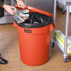 This Lavex 32 gallon orange commercial trash can and lid is the ideal solution for efficient waste management in your establishment. The can and lid are made of a durable resin material that holds up well to the wear and tear of being in a commercial environment. With strong handles and a reinforced bottom, the can is easy to lift and move from one place to another without fear of breaking or warping. Use the included lid to seal the container, trapping in unpleasant odors and concealing waste f Trash Storage, Trash Can With Lid, Food Handling, Can Lids, Hotel Supplies, Waste Management, Clean Office, Garbage Bag, Recycle Trash