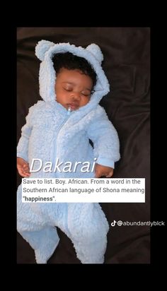 a baby in a blue bear suit sleeping on top of a black blanket with the caption dakari save to list boy african from world in the southern african language