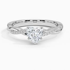 a white gold engagement ring with a heart shaped diamond