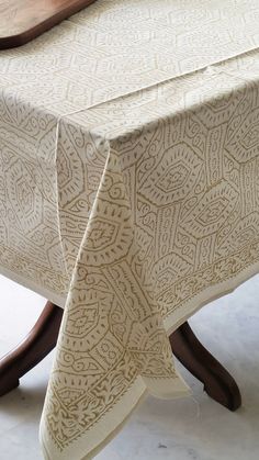 a white table cloth with an intricate design on it