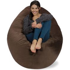 a woman sitting on a bean bag chair