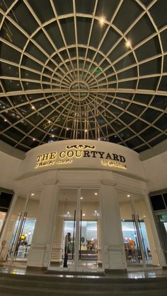 the court yard entrance is lit up at night