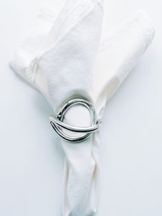 a napkin with a ring on top of it