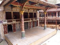 an elaborately decorated stage with pillars and arches