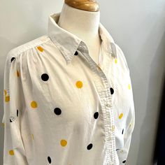 Super cute LizSport white cotton blouse is merrily patterned with black and yellow dots. Gathered yokes, full sleeves that have tabs to roll, and soft 100% cotton. Absolutely wonderful condition.  Measurements:  22" underarm to underarm, laid flat  27" inches long  Please check out my other listings here: https://www.etsy.com/ca/shop/FernwoodFashionista?ref=seller-platform-mcnav Follow me on Instagram, Facebook and Pinterest @fernwoodfashionista for all the latest additions to my shop.   All pro Polka Dot Long Sleeve Shirt For Spring, Relaxed Fit Cotton Blouse With Polka Dot, Relaxed Fit Cotton Blouse In Polka Dot, Polka Dot Cotton Blouse With Relaxed Fit, Cotton Polka Dot Blouse With Relaxed Fit, Polka Dot Long Sleeve Top With Relaxed Fit, Long Sleeve Polka Dot Top With Relaxed Fit, Collared Polka Dot Cotton Top, Collared Cotton Polka Dot Tops