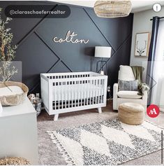 a baby's room decorated in black and white