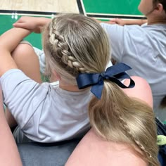 Soccer/volleyball hairstyle with bow Girls Hockey Hairstyles, Hair For Volleyball Pictures, Hoco Game Hairstyles, Braids For Game Day, Volleyball Hairstyles With Bow, Volleyball Girl Hairstyles, Simple Cheer Hairstyles, Slick Back Hairstyles Braid