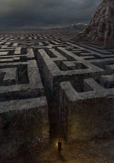 a man standing in the middle of a maze