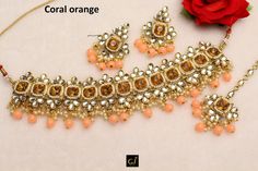 *Light Weight Gold White, Antique Gold,Coral orange Kundan Choker Adjustable necklace set with earrings and tikka. *Studded with kundan stone. *Necklace widht- 2 inches (included pearl drop) *Earrings Length- 2.4 inches(included pearl drop) *Breadth- 1.3 inches Traditional Orange Jewelry For Diwali, Orange Jewelry For Wedding And Festivals, Orange Jewelry For Wedding And Diwali, Indian Jewelry Choker, Orange Choker, Kundan Choker Necklace, Bridal Jewelry Necklace, Indian Nose Ring, Kundan Choker