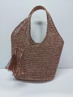 Shiny raffia rope knit shoulder bag, unlined, with tassel detail, can be used day and night at the beach  Width 39 cm. X  length cm. X stem length cm. X base width 10 cm. Casual Beach Bag With Tassels For Shopping, Beach Straw Shoulder Bag With Tassels, Beach Shoulder Straw Bag With Tassels, Summer Beach Bucket Bag With Tassels, Tasseled Tote Hobo Bag For Vacation, Tasseled Hobo Tote Bag For Vacation, Beach Rectangular Hobo Bag With Tassels, Vacation Tote Hobo Bag With Tassels, Chic Beach Shoulder Bag With Tassels