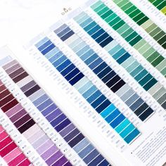 the pantoner color chart is displayed on top of a table with other colors