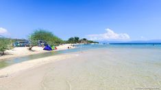 the beach is clean and clear for people to enjoy in it's natural surroundings