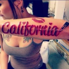 a woman with a tattoo that says california on her arm and the word's name is