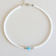 Aquamarine choker bead choker necklace seed bead choker Christmas gift for her beaded choker beach jewelry choker necklace for woman Free shipping is available for orders to the United States, with a purchase of $ 35. This beautiful necklace is made of white, silver beads and one aquamarine (size 6 mm) bead in the middle. Please choose at an order length of necklace. Each choker comes with a 2 inch adjustable extender chain. Summer Spacer Bead Choker Jewelry, Turquoise Choker With Round Beads For Summer, Beaded Strand Jewelry As A Gift, Dainty Beach Choker Jewelry, Summer Gemstone Beads Necklace Gift, Summer Gemstone Beads Necklace, Tiny Beads Choker Jewelry For Beach, Beaded Strand Jewelry Gift, Beaded Turquoise Choker For Gift