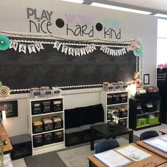 an empty classroom with blackboard and writing on the wall