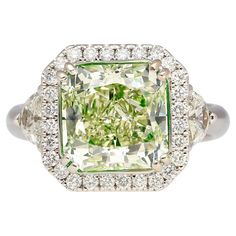 Jewelry Details: Item Type: Diamond Ring Metal Type: 18K White Gold Weight: 7.27 grams Ring Size: 6 Center Stone Details: Gemstone Type: Diamond Shape: Radiant Cut Carat: 4.26 Carats Color: Fancy Yellowish Green Clarity: SI1 Certification: GIA Certified Certificate Number: #2145802932 Side Stone Details: Gemstone Type: Diamonds Carat:Half-Moon Diamonds: 0.50 Carats Round Cut Diamonds: 0.50 Carats Description: This 18K White Gold Diamond Ring features a GIA Certified 4.26 Carat Radiant Cut Fancy Exquisite Luxury Green Diamond Ring, 1stdibs Jewelry, Fancy Color Diamond Ring, Colored Diamond Jewelry, Yellowish Green, Expensive Jewelry Luxury, Jewelry Details, White Gold Diamond Rings, Expensive Jewelry