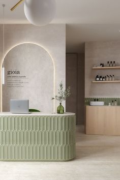 the interior of a salon with green counter tops and white walls, along with shelving