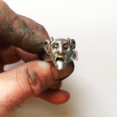 This "Listening Devil" ring is an original, handcrafted sterling silver piece with a HEAVY, SOLID construction. This ring is handmade, well crafted and organically styled for any man looking to make a statement.  Please view our video for more product detail https: https://youtu.be/plGuhkRCbi8 Lugdun Artisans is an American-born company dedicated to building quality handcrafted jewelry. Each and every piece made is created in their workshop, right here in New York. The Lugdun artisans create unique and custom-made jewelry designed to be rugged, tough, big, heavy, modern, sophisticated or just plain cool. Quality precious metals are used, mainly consisting of sterling silver, to bring you rings, bracelets, chains & pendants that are heavy and durable. Lugdun Artisans are a great choice for Unique Hand Cast Sterling Silver Signet Ring, Unique Silver Skull Ring Hallmarked, Unique Sterling Silver Skull Ring, Unique Sterling Silver Skull Ring With Polished Finish, Unique Silver Skull Ring Collectible, Artistic Hand Cast Sterling Silver Rings, Unique Sterling Silver Skull Open Ring, Sterling Silver Open Skull Ring, Unique Hallmarked Skull Ring As Gift