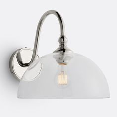 a light that is on the side of a wall mounted fixture with a glass shade