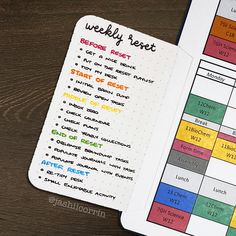 an open planner with colorful writing on it