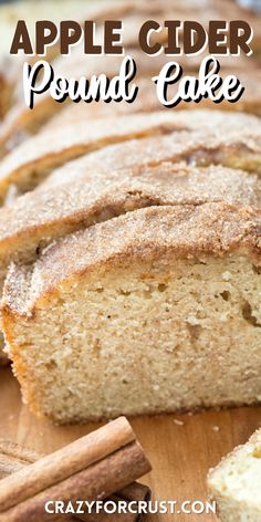 a loaf of apple cider pound cake on a wooden cutting board with cinnamon sticks