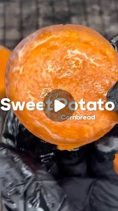 a person holding an orange in their hand with the words sweet potato combined on it