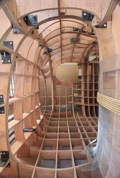 the inside of a wooden structure with many shelves