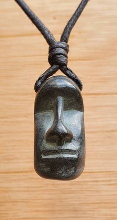 Easter Island Head Moai pendant. I handcarved this pendant by hand from green granit, it's south Indian stone semiller to soapstone but more hard and durable then the soapstone. The colour of the stone is very dark green almost looks black.  The size of the pendant is approx 3cm x 1.5cm (1.2 x 0.6 inches ). The pendant comes with an adjustable black waxed cotton cord. Not only are these pendants a beautiful thing to wear as part of your jewellery collection, but they are also very pleasing to the touch. The weight and smoothness of the hand carved stone makes these pendants a tactile comfort, as well as a one of a kind adornment. Moai (Ester Island Head) Moʻai, or moai, are monolithic human figures carved by the Rapa Nui people on Easter Island in eastern Polynesia between the years 1250 a Sand Stone Carving, Stone Wall Art Pendant, Carving Resin With Dremel, Wood Stone Necklace, Dremel Necklace, Easter Island Heads, Indian Stone, Protection Talisman, Pebble Pendant